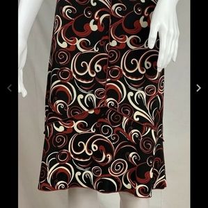 Parallel fillagree print a-line exposed seam skirt